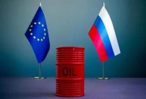 Прапори ЄС і Росії з бочкою нафти як символ тиску на покупців російської нафти